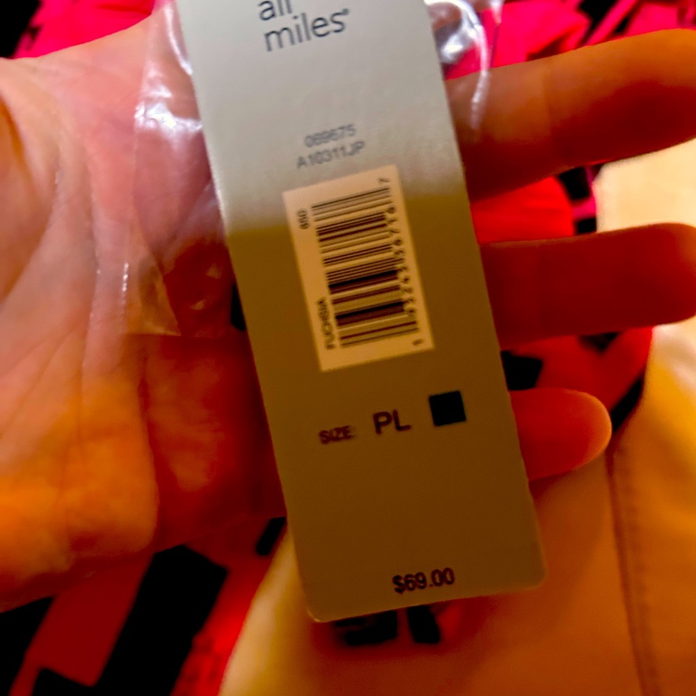 This is a pink and black blouse